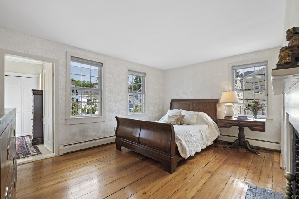 80 Front Street Marblehead, MA 01945 - Photo 29 of 42 a bed room with a bed window and a chair