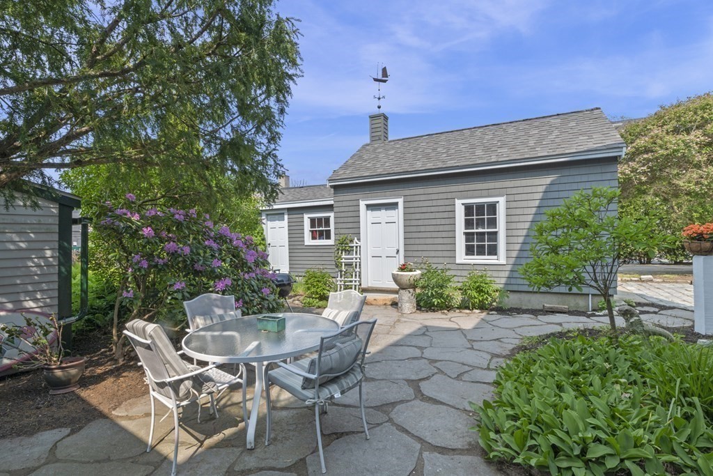 80 Front Street Marblehead, MA 01945 - Photo 6 of 42 a view of a patio with table and chairs and potted plants