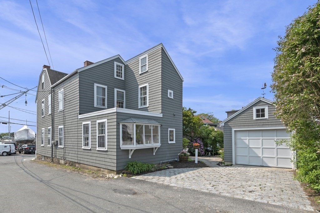 80 Front Street Marblehead, MA 01945 - Photo 7 of 42 a front view of a house with a yard