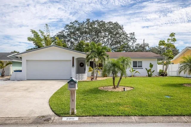 a house with garden in front of it