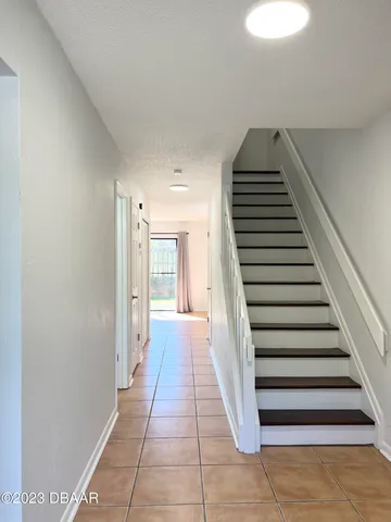 a view of a bathroom with stairs and wooden floor