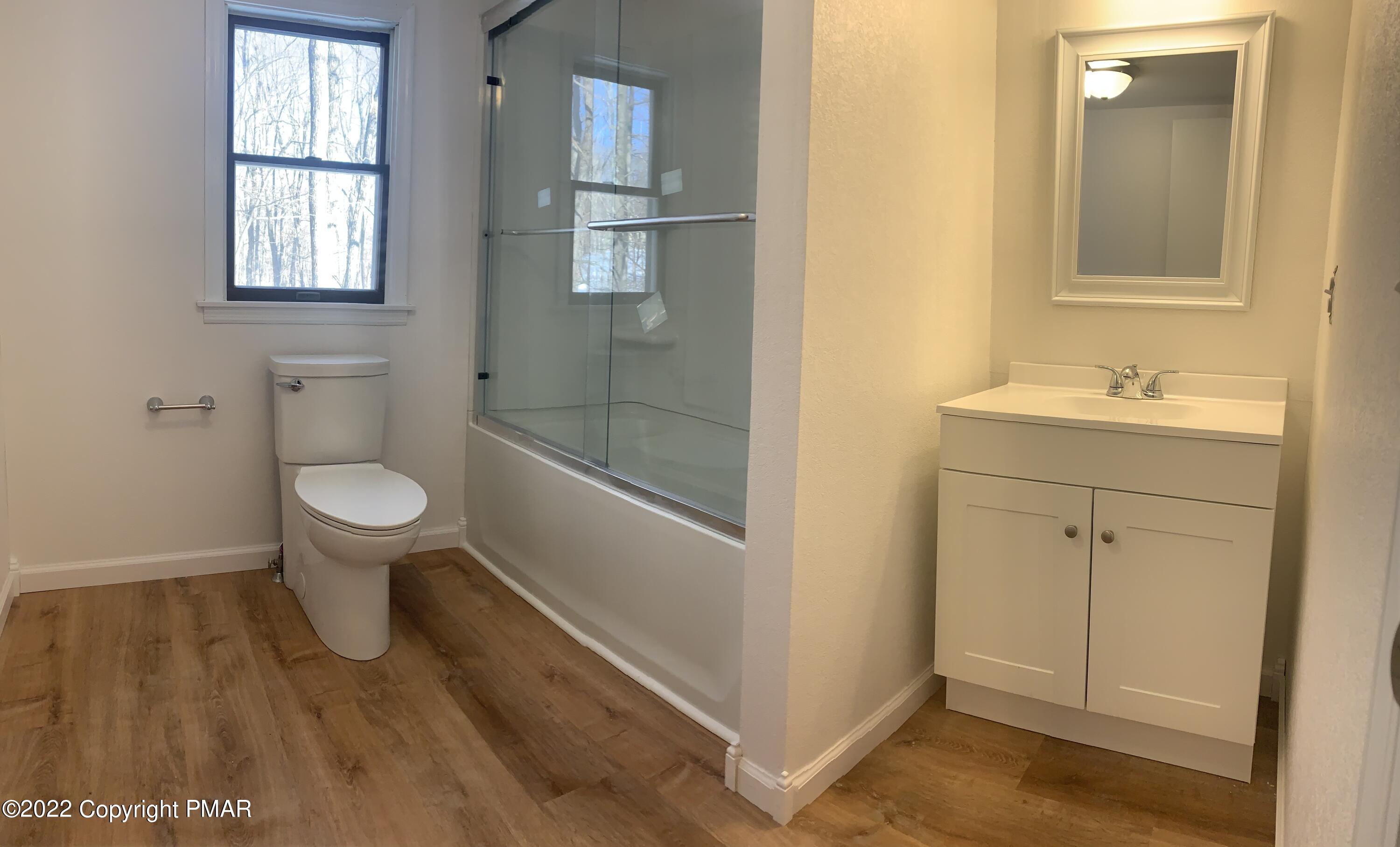 518 Henry's Crossing Road Cresco, PA 18326 - Photo 18 of 27 a bathroom with a toilet and a sink