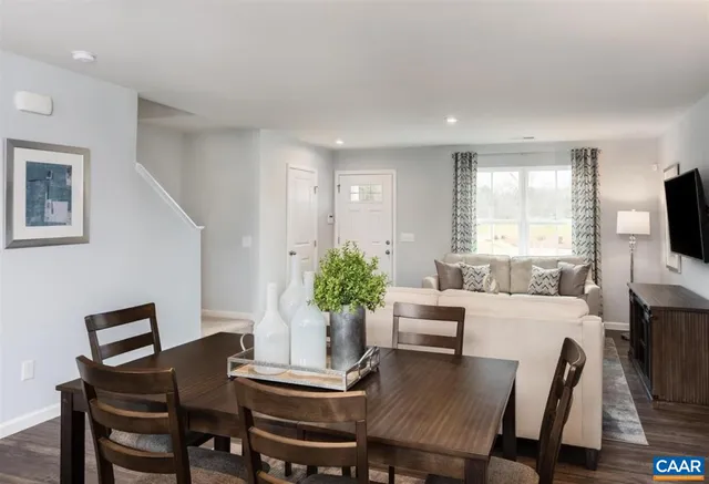 a view of a dining room with furniture and window