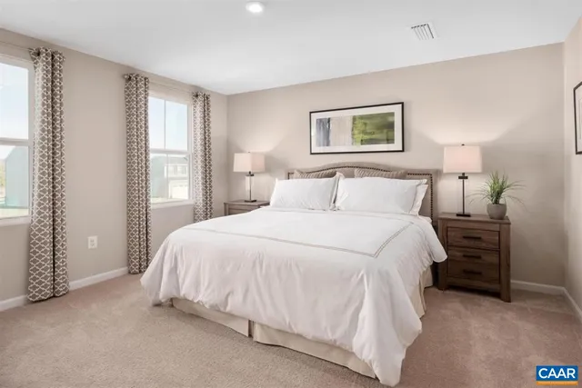 a bedroom with a bed and a night stand