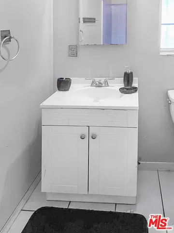 a bathroom with a sink and a cabinets