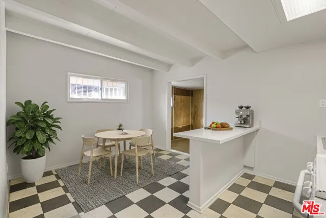 a dining room with a table and chairs in it