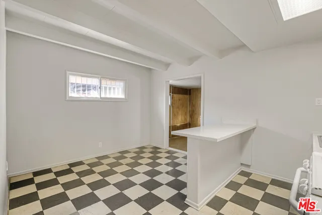 a view of a bedroom with window