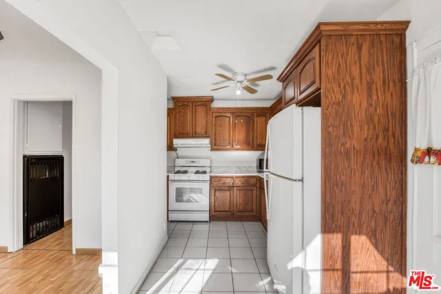 a kitchen with stainless steel appliances a refrigerator and a stove