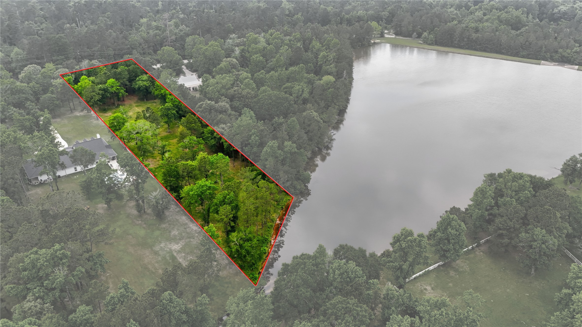 2302 Honea Egypt Road Magnolia, TX 77354 - Photo 10 of 12 a view of a lake