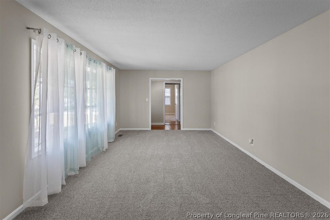 630 Bedford Road Fayetteville, NC 28303 - Photo 5 of 21 a view of an empty room with a window