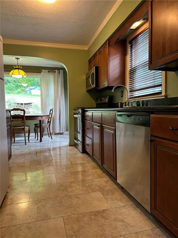 33 Union Avenue Pittsburgh, PA 15205 - Photo 5 of 32 a kitchen with stainless steel appliances granite countertop a stove a sink and a microwave
