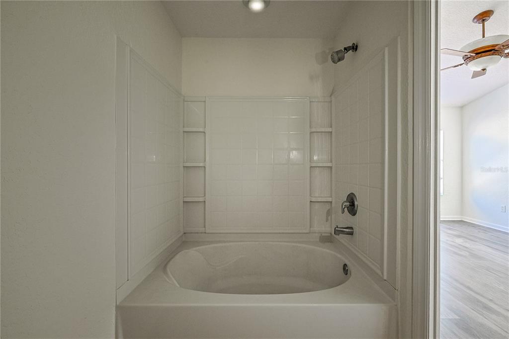 4116 Southwest 54th Circle Ocala, FL 34474 - Photo 17 of 36 a close up of a bathtub in a bathroom