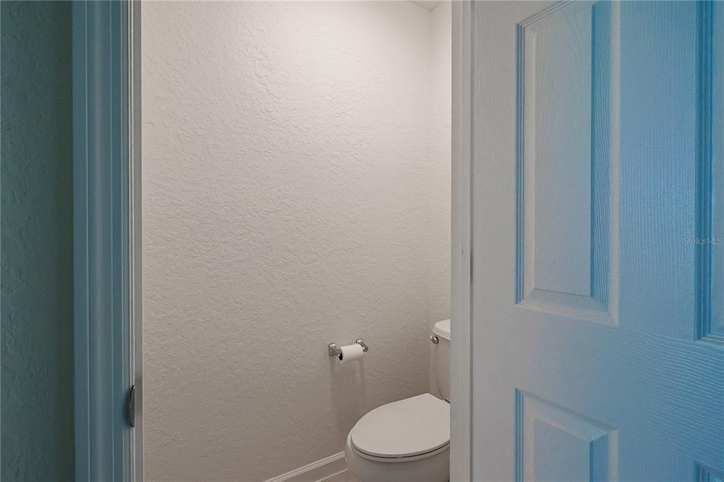 4116 Southwest 54th Circle Ocala, FL 34474 - Photo 18 of 36 a white toilet sitting next to a white sink