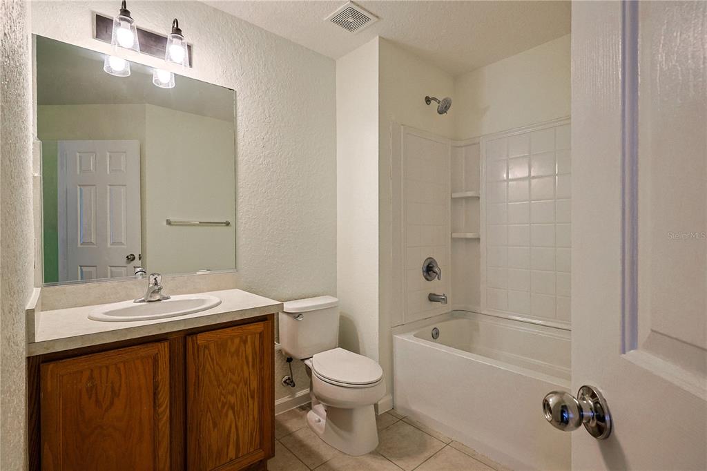 4116 Southwest 54th Circle Ocala, FL 34474 - Photo 20 of 36 a bathroom with a sink a toilet and shower