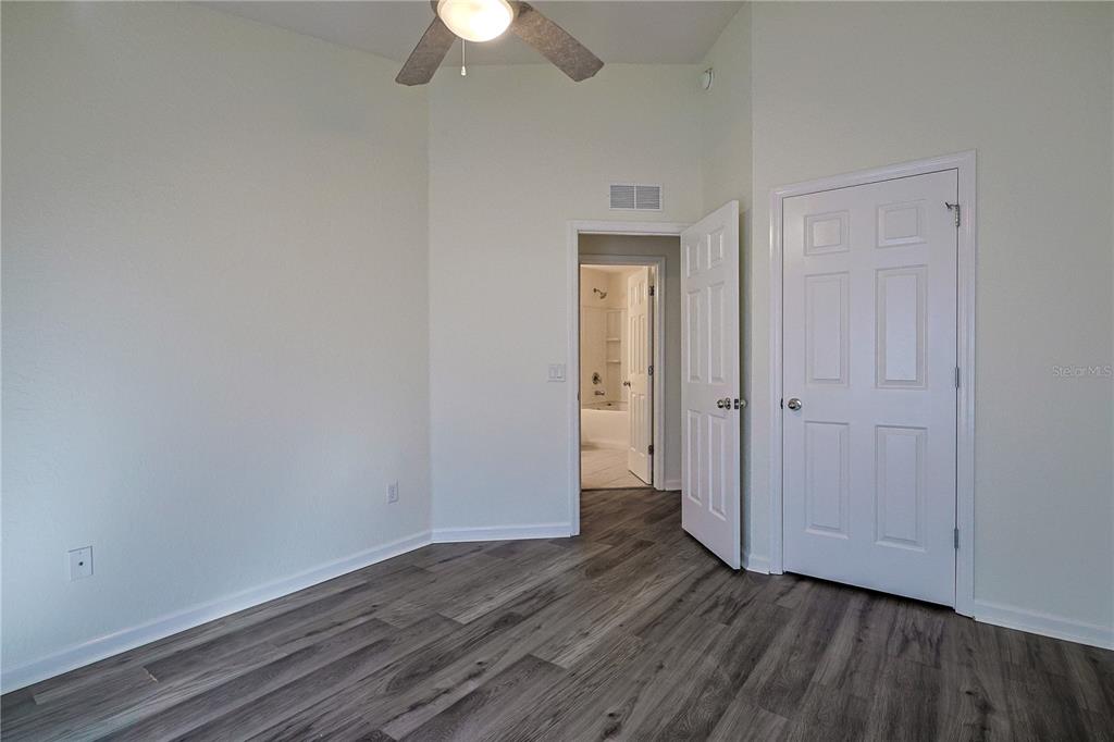4116 Southwest 54th Circle Ocala, FL 34474 - Photo 22 of 36 a view of an empty room with wooden floor