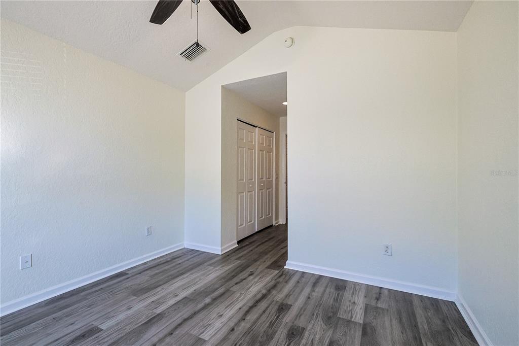 4116 Southwest 54th Circle Ocala, FL 34474 - Photo 26 of 36 a view of an empty room with wooden floor