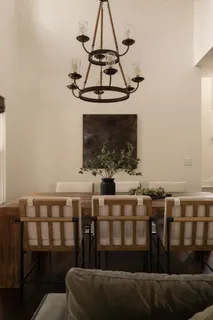 a view of a dining room with furniture wooden floor and chandelier