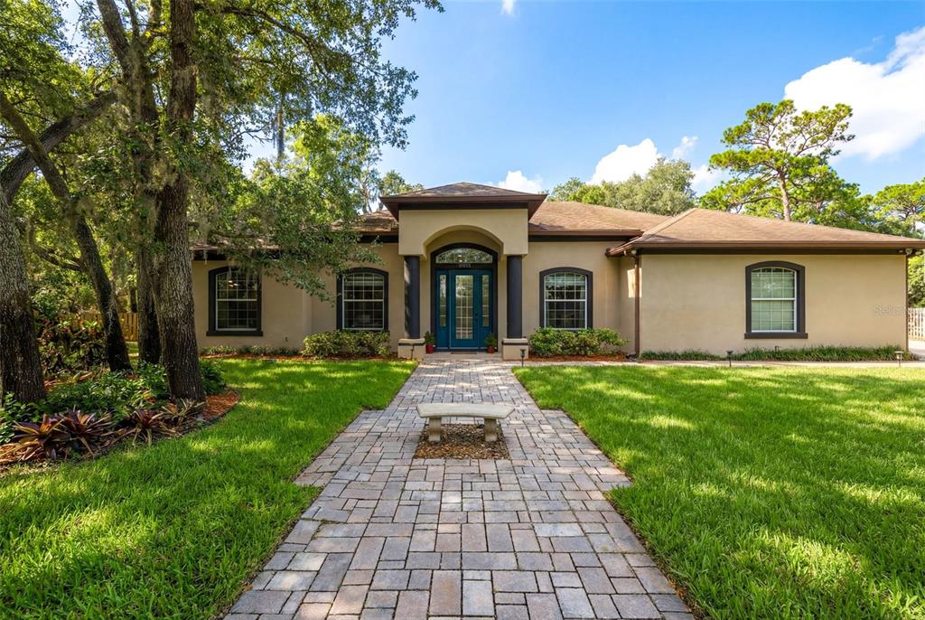 a front view of a house with garden