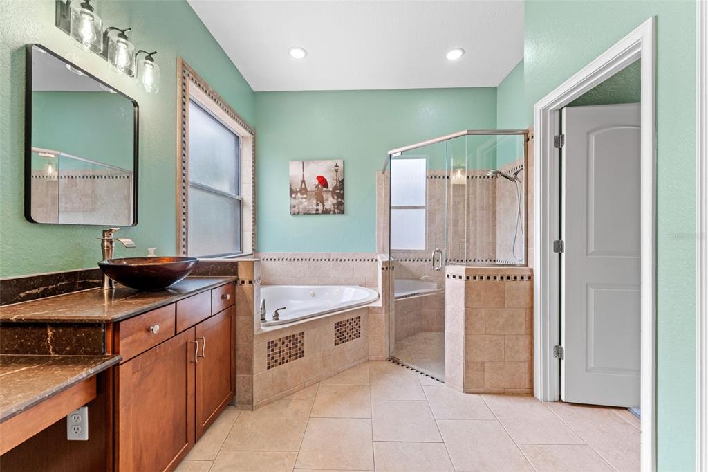 5130 Morning Dew Loop Oviedo, FL 32765 - Photo 18 of 38 a kitchen with stainless steel appliances granite countertop a refrigerator and a sink