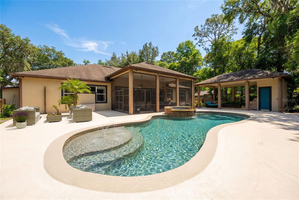 5130 Morning Dew Loop Oviedo, FL 32765 - Photo 2 of 38 a view of a house with swimming pool and a yard