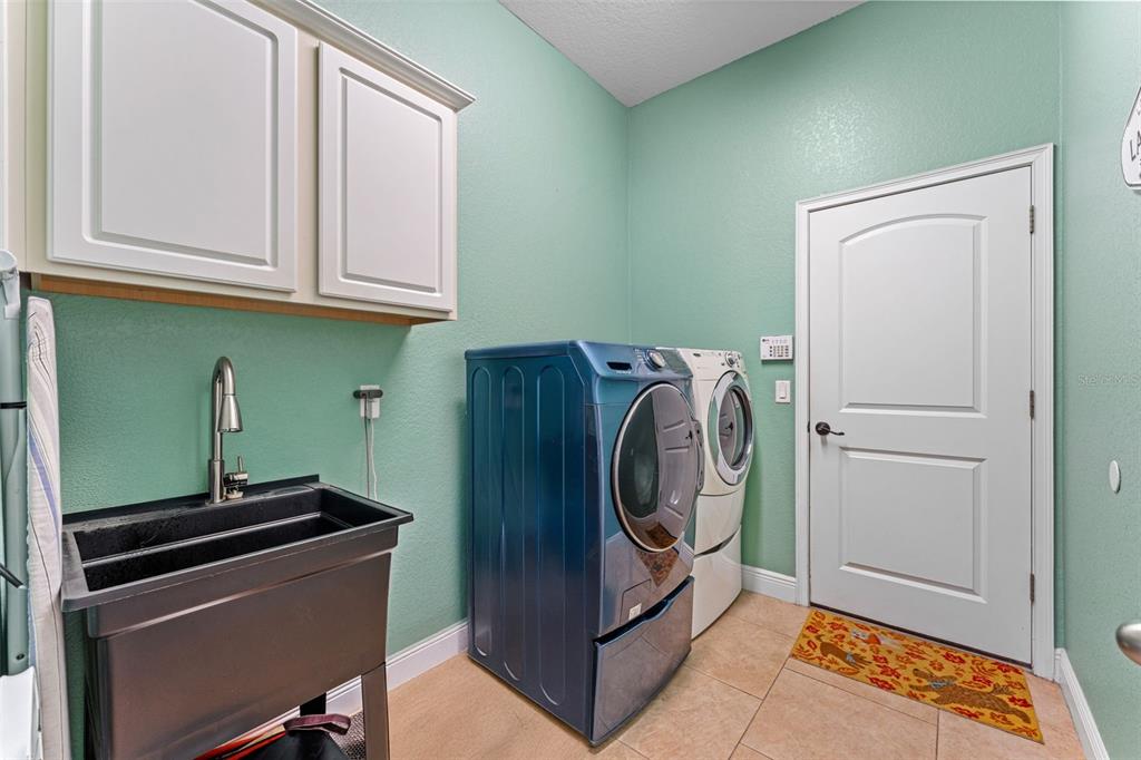 5130 Morning Dew Loop Oviedo, FL 32765 - Photo 26 of 38 a utility room with dryer and washer