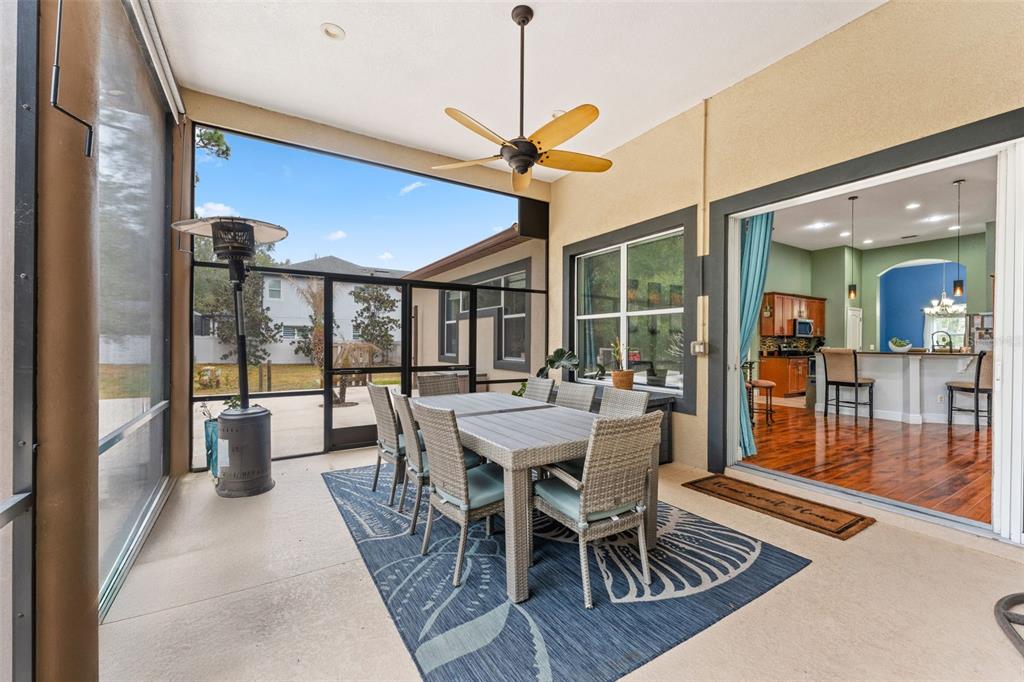 5130 Morning Dew Loop Oviedo, FL 32765 - Photo 28 of 38 a view of a dining room and livingroom with furniture wooden floor a chandelier