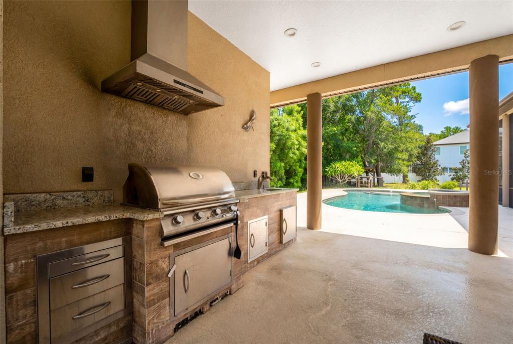 5130 Morning Dew Loop Oviedo, FL 32765 - Photo 31 of 38 a kitchen with a stove and a microwave