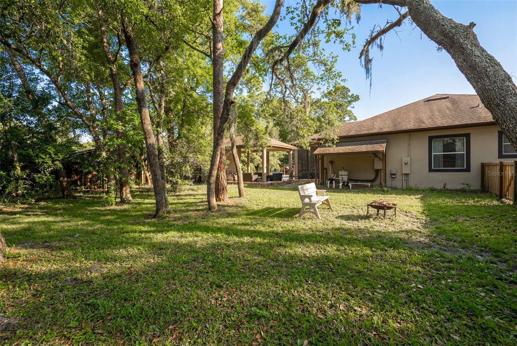 5130 Morning Dew Loop Oviedo, FL 32765 - Photo 33 of 38 a swimming pool with outdoor seating and yard
