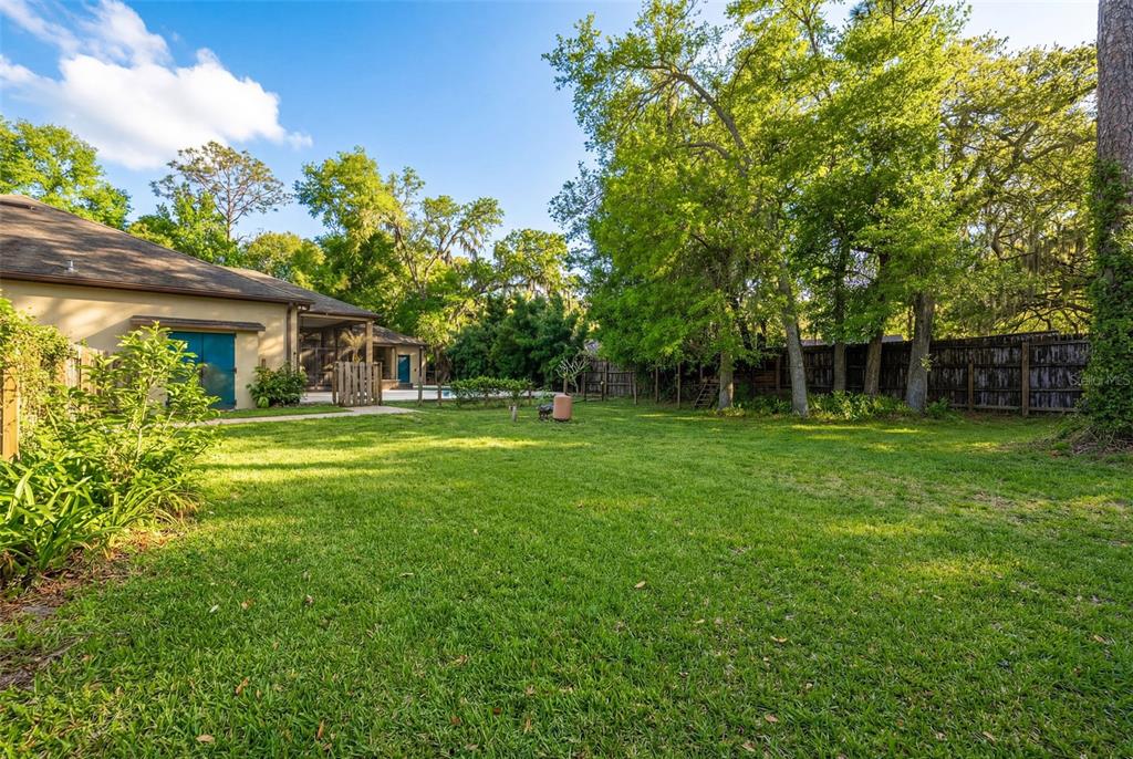 5130 Morning Dew Loop Oviedo, FL 32765 - Photo 36 of 38 a front view of a house with a yard