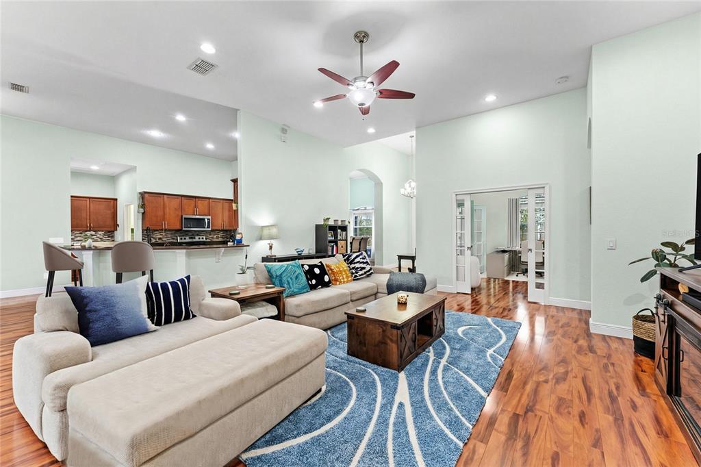 5130 Morning Dew Loop Oviedo, FL 32765 - Photo 4 of 38 a living room with furniture kitchen view and a large window