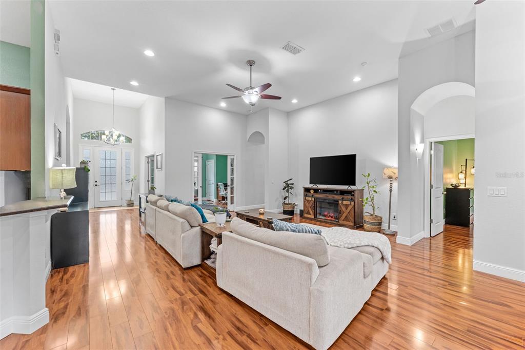 5130 Morning Dew Loop Oviedo, FL 32765 - Photo 6 of 38 a living room with furniture fireplace and a flat screen tv