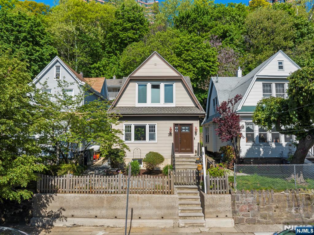 370 Undercliff Avenue Edgewater, NJ 07020 - Photo 1 of 35 a front view of a house with a yard