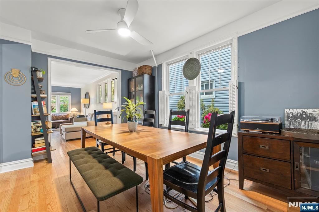 370 Undercliff Avenue Edgewater, NJ 07020 - Photo 17 of 35 a view of a dining room and livingroom with furniture wooden floor and a rug