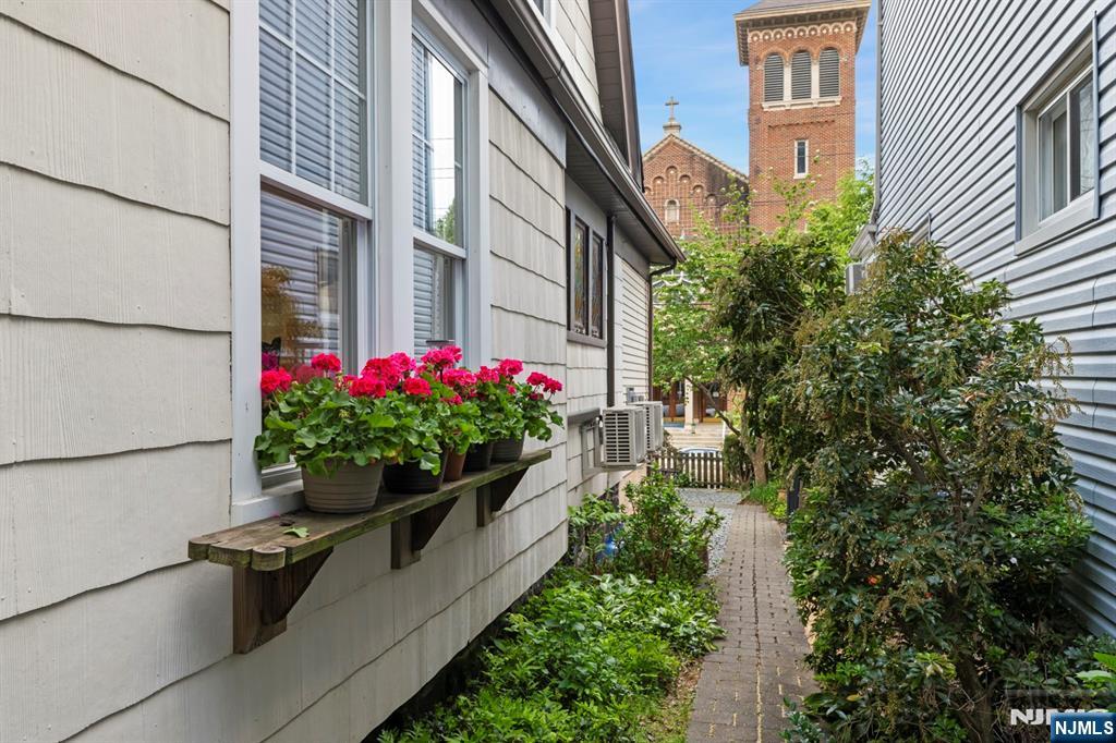 370 Undercliff Avenue Edgewater, NJ 07020 - Photo 20 of 35 a flower garden is sitting in front of a house
