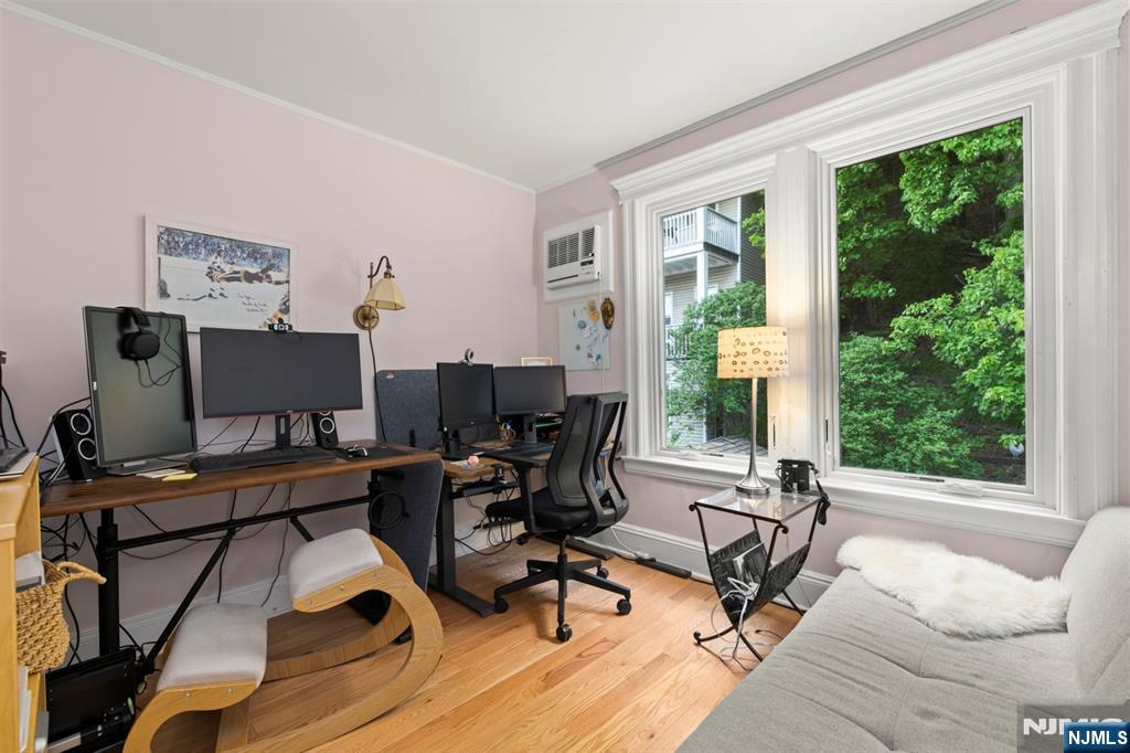 370 Undercliff Avenue Edgewater, NJ 07020 - Photo 26 of 35 a view of a livingroom with workspace and a window