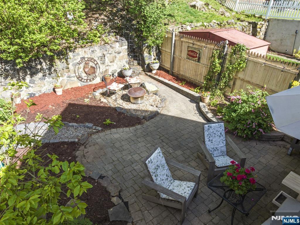 370 Undercliff Avenue Edgewater, NJ 07020 - Photo 29 of 35 a view of a chairs and table in the backyard