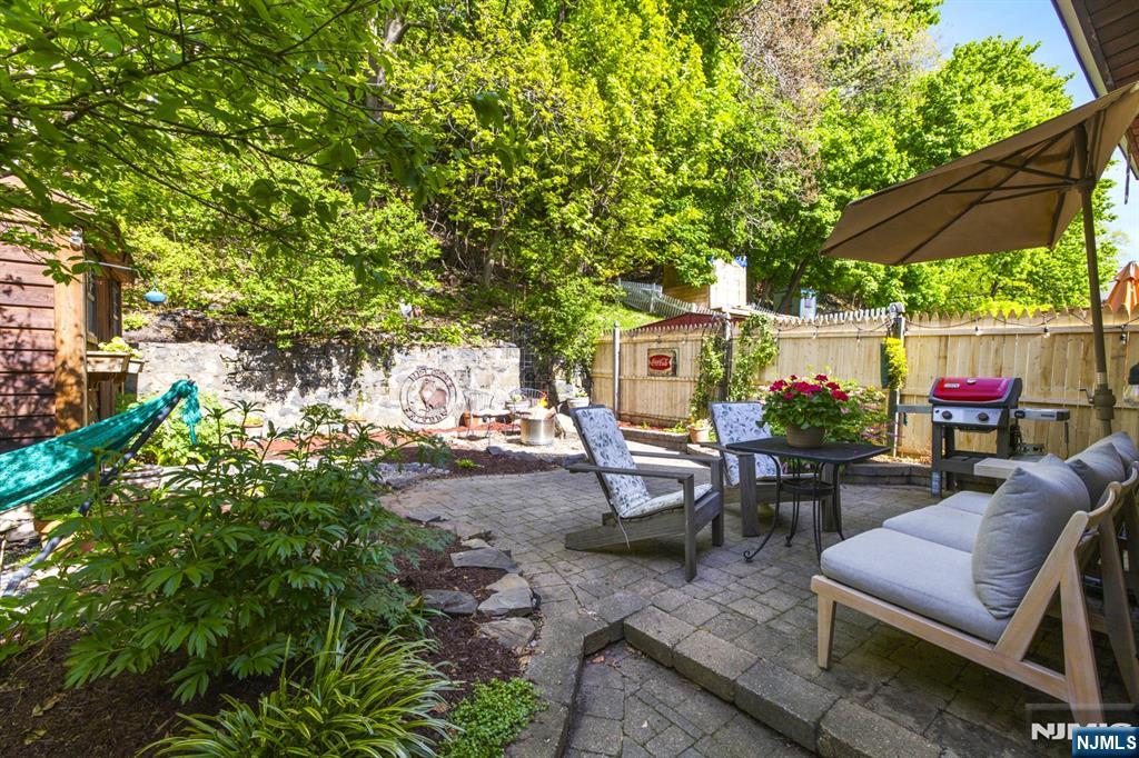 370 Undercliff Avenue Edgewater, NJ 07020 - Photo 30 of 35 an outdoor sitting area with couch and plants