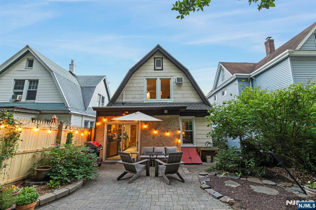 370 Undercliff Avenue Edgewater, NJ 07020 - Photo 34 of 35 a view of patio with a table and chairs under an umbrella
