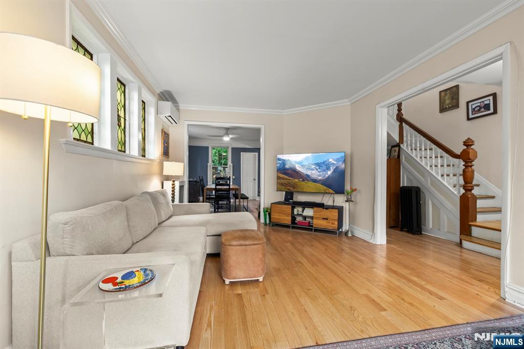370 Undercliff Avenue Edgewater, NJ 07020 - Photo 7 of 35 a living room with furniture and a flat screen tv