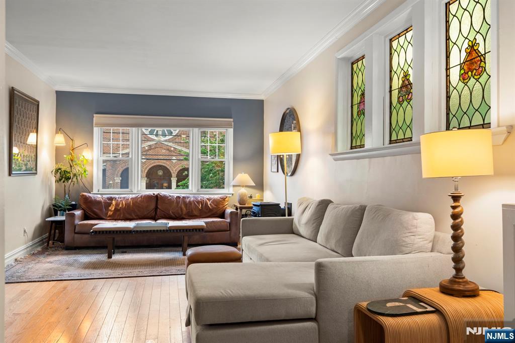 370 Undercliff Avenue Edgewater, NJ 07020 - Photo 8 of 35 a living room with furniture and a large window
