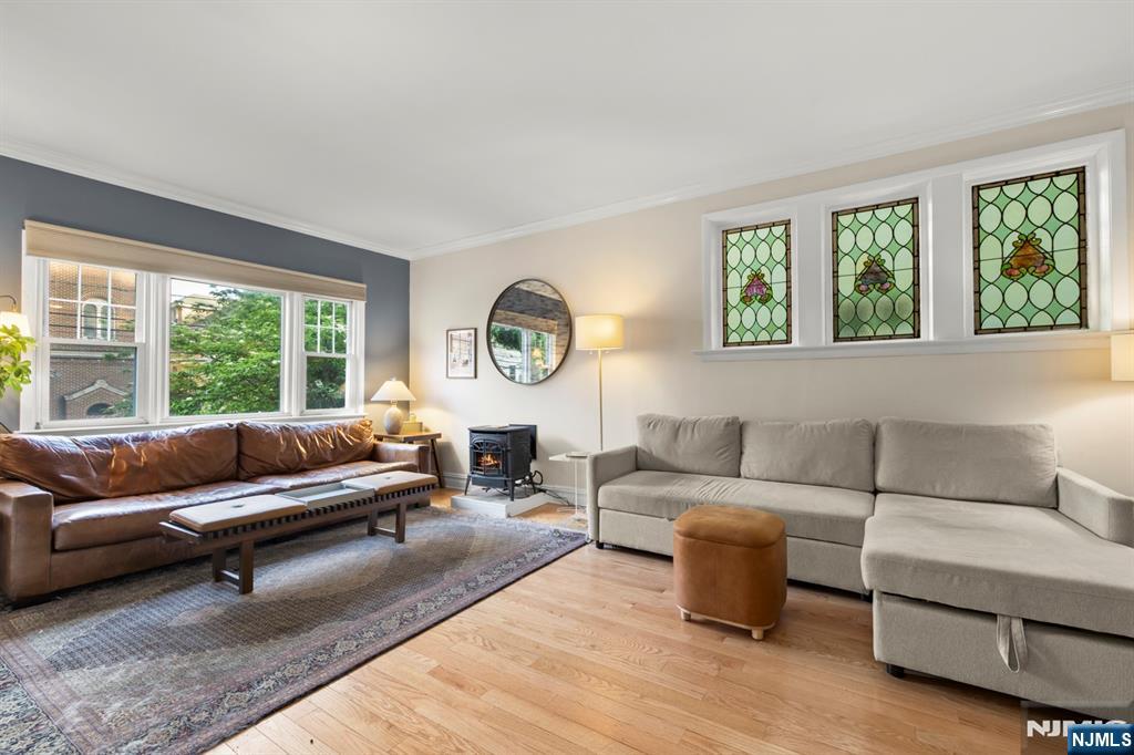 370 Undercliff Avenue Edgewater, NJ 07020 - Photo 10 of 35 a living room with furniture and a large window