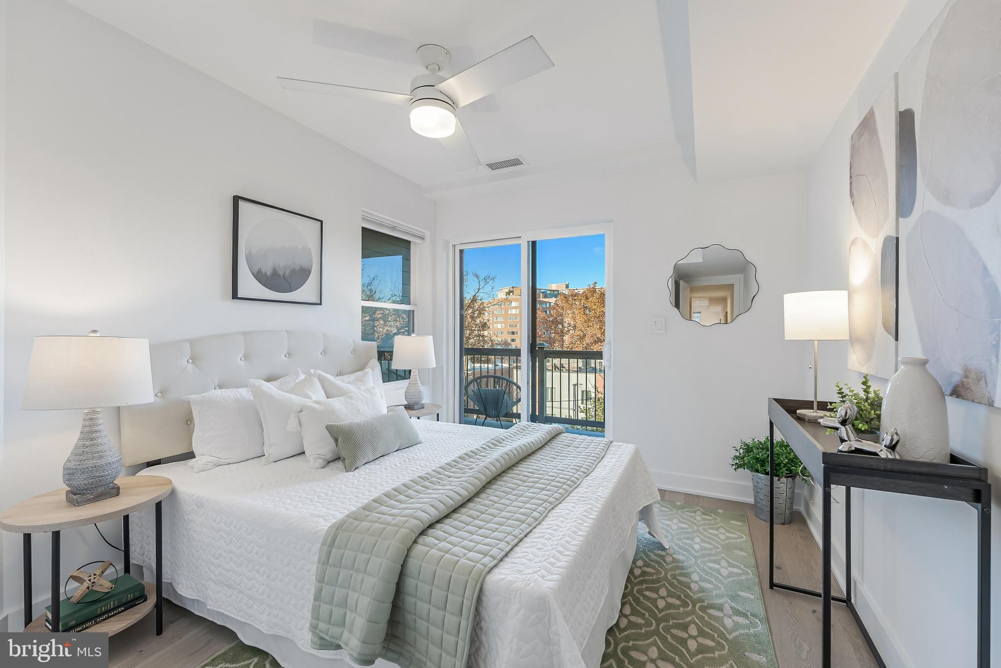 4017 Davis Place Northwest, Unit 6 Washington, DC 20007 - Photo 10 of 17 a bedroom with a bed and a chandelier