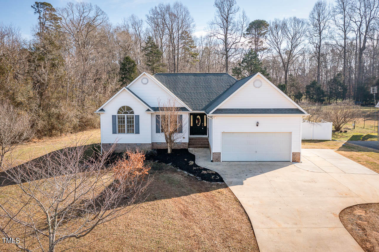 4552 Springbrook Drive Burlington, NC 27215 - Photo 1 of 57 a front view of a house with a yard