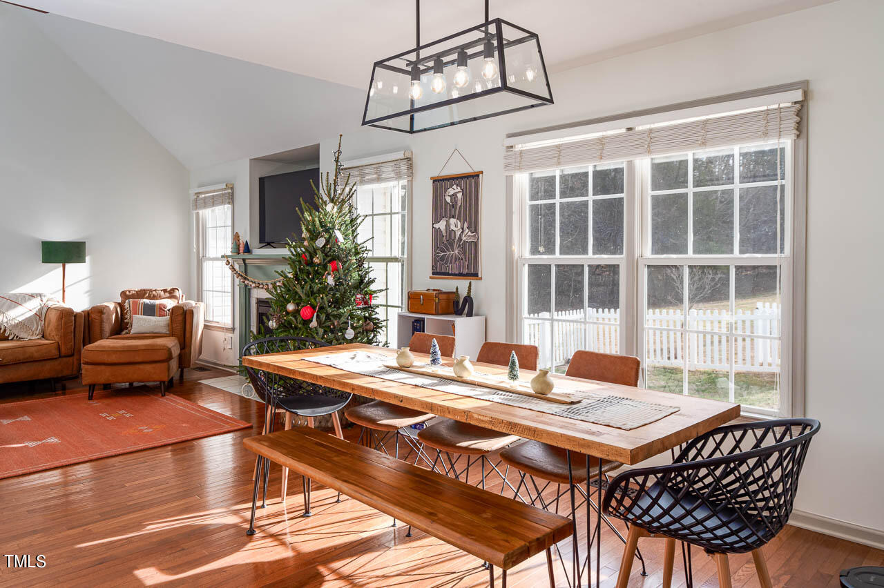 4552 Springbrook Drive Burlington, NC 27215 - Photo 19 of 57 a dining room with a wooden table and chairs
