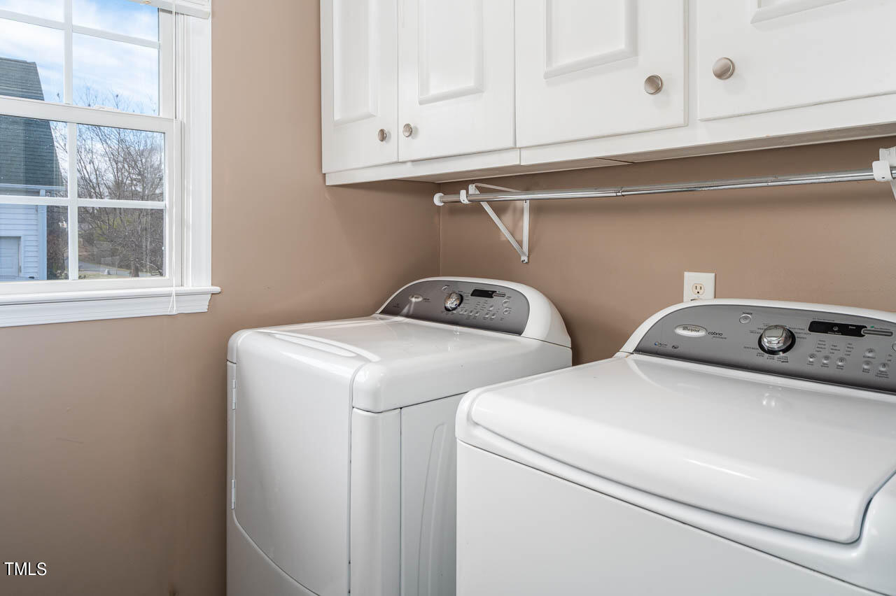 4552 Springbrook Drive Burlington, NC 27215 - Photo 20 of 57 a utility room with dryer and washer