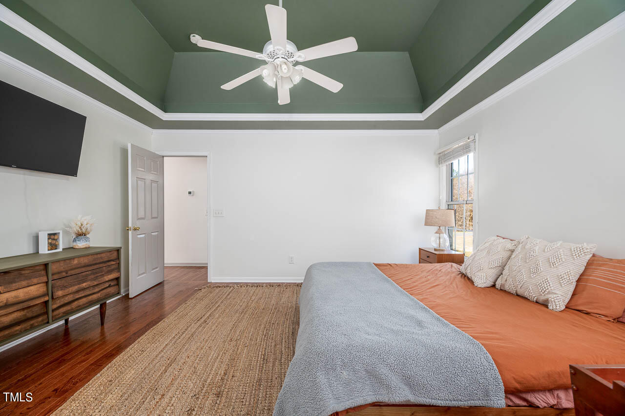 4552 Springbrook Drive Burlington, NC 27215 - Photo 23 of 57 a bedroom with a bed and a flat screen tv
