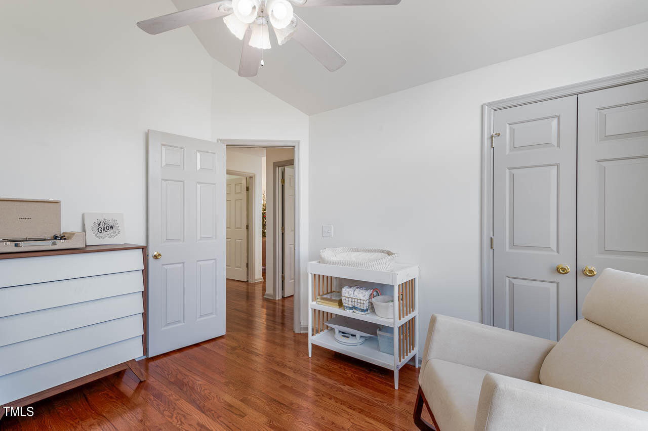 4552 Springbrook Drive Burlington, NC 27215 - Photo 25 of 57 a living room with furniture and a wooden floor