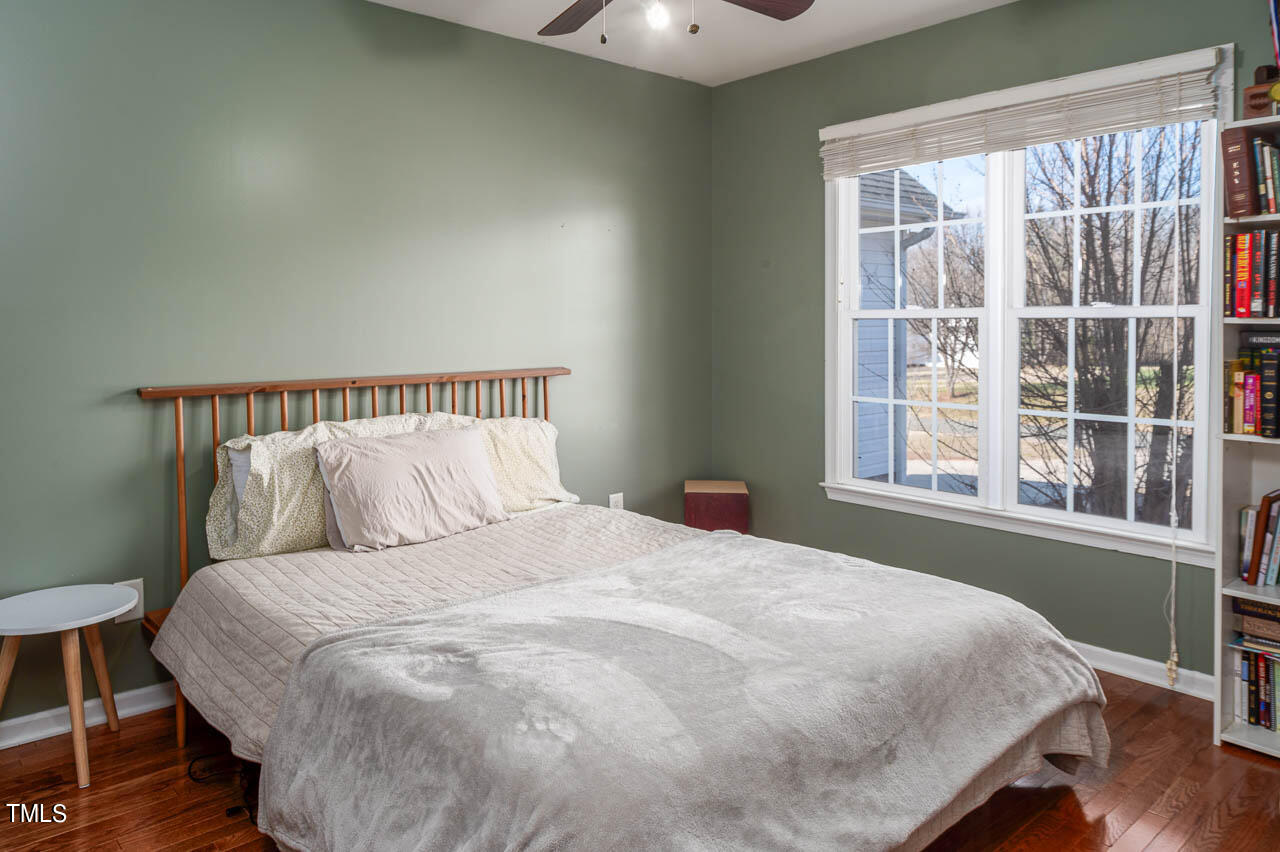 4552 Springbrook Drive Burlington, NC 27215 - Photo 26 of 57 a large bed sitting in a bedroom next to a window