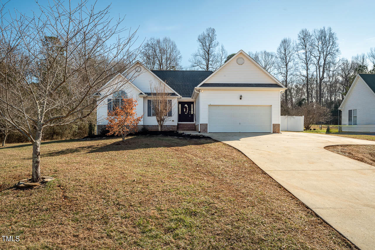 4552 Springbrook Drive Burlington, NC 27215 - Photo 3 of 57 a front view of a house with a yard and garage