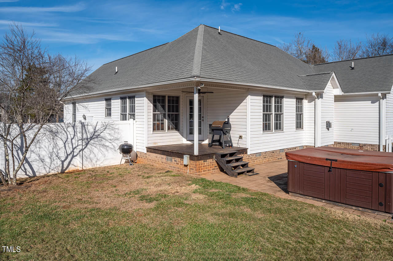 4552 Springbrook Drive Burlington, NC 27215 - Photo 32 of 57 a backyard of a house with yard and outdoor seating